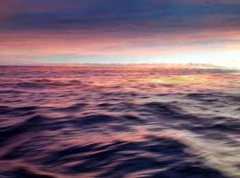 Scenic view of cloudy sky at sunset