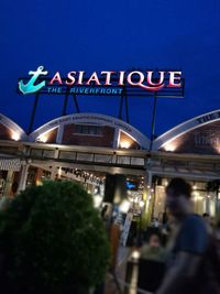 Illuminated bridge at night