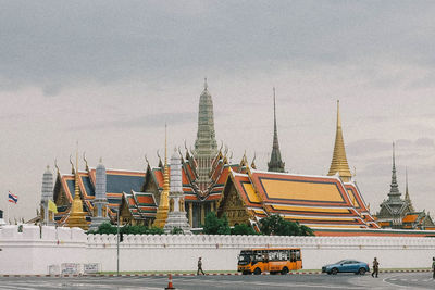 Low angle view of pagoda and buildings against sky