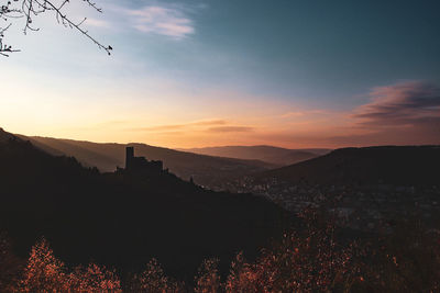 Scenic view of silhouette mountain against sky during sunset