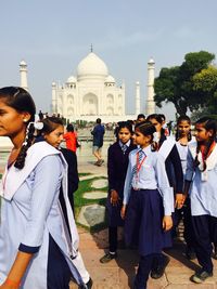 Group of people in front of historical building