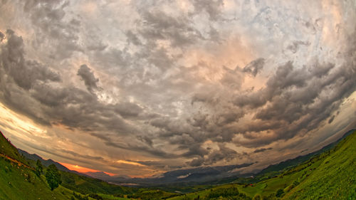 Scenic view of landscape against sky during sunset