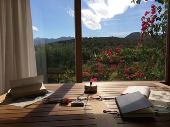 Empty chairs and tables against mountain