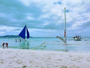 Scenic view of sea against cloudy sky