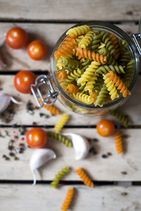 High angle view of fruits in jar on table