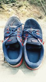 High angle view of shoes on sand