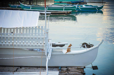 Fishing boats moored in lake