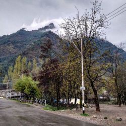 Scenic view of mountains against cloudy sky