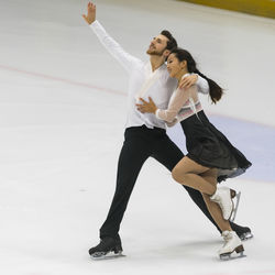 Full length of couple dancing on ice rink