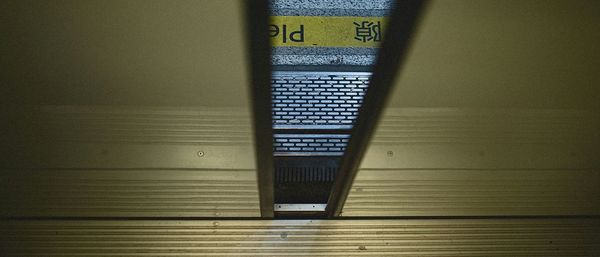 Railroad station platform seen through subway train door