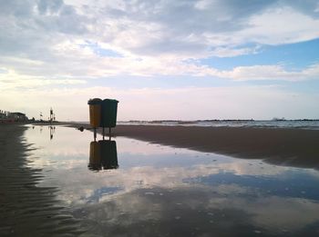 Scenic view of sea against cloudy sky