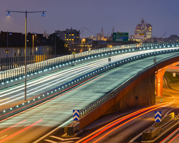 High angle view of light trails on road at night