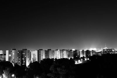 Panoramic view of city against clear sky at night