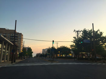 Road along buildings at dusk