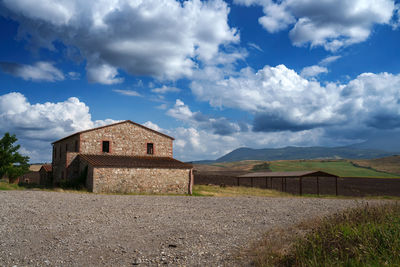 House on field against sky