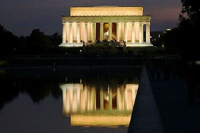 Building reflecting in water