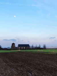 House on field against sky