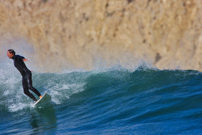 Man surfing in sea