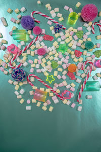 High angle view of multi colored candies on table