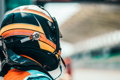 Close-up of person wearing crash helmet