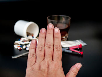 Close-up of person holding glass