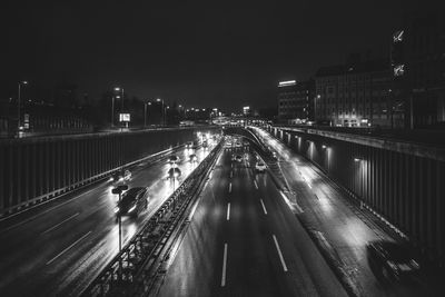 View of bridge in city at night