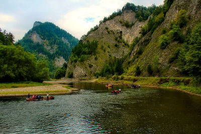 Scenic view of river amidst trees and mountains