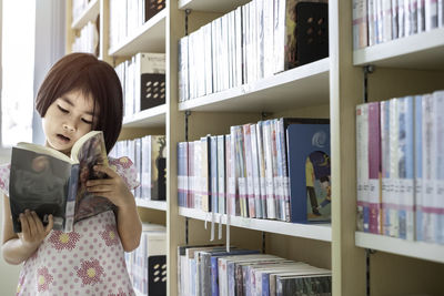 Full length of woman reading book