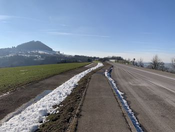 Empty road along landscape