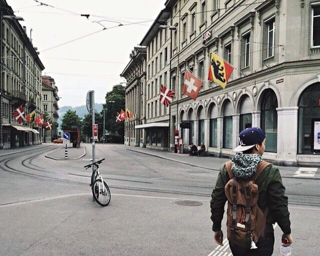 MAN WITH UMBRELLA ON ROAD