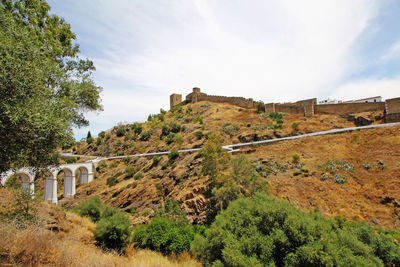 View of castle against cloudy sky