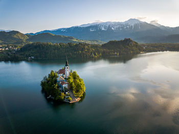 Scenic view of lake and mountains against sky