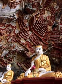 Low angle view of buddha statue in temple