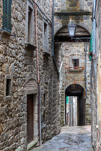 Alley amidst buildings in city