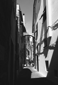 Narrow street amidst buildings in town