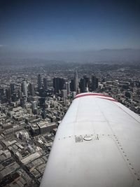 Aerial view of cityscape against sky