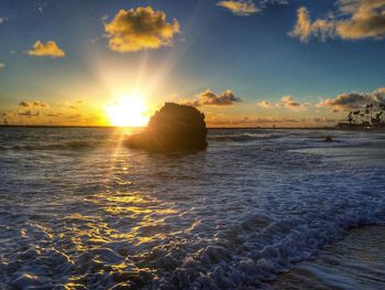 Scenic view of sea at sunset