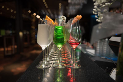 Close-up of wine glasses on table