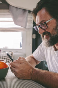 Close-up of man preparing food at home