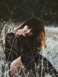 Close-up portrait of young woman standing outdoors