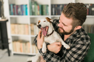 Man with dog at home