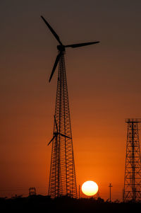 Wind turbines in the thar desert in rajasthan during sunset