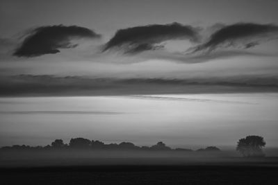 Scenic view of silhouette trees against sky during sunset
