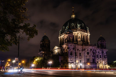 Illuminated building against sky at night