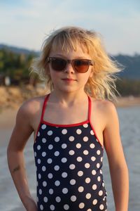 Portrait of young woman wearing sunglasses