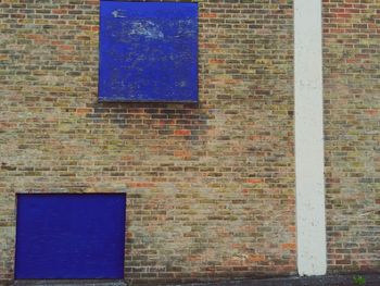 Close-up of window on brick wall