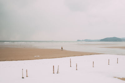 Scenic view of beach against sky