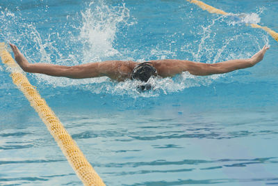 Man swimming in pool