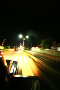 Cars moving on road at night