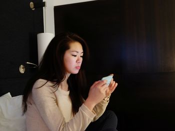 Young woman using mobile phone